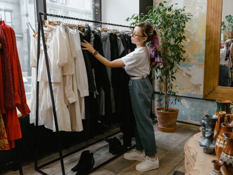Woman browsing clothing racks in a boutique